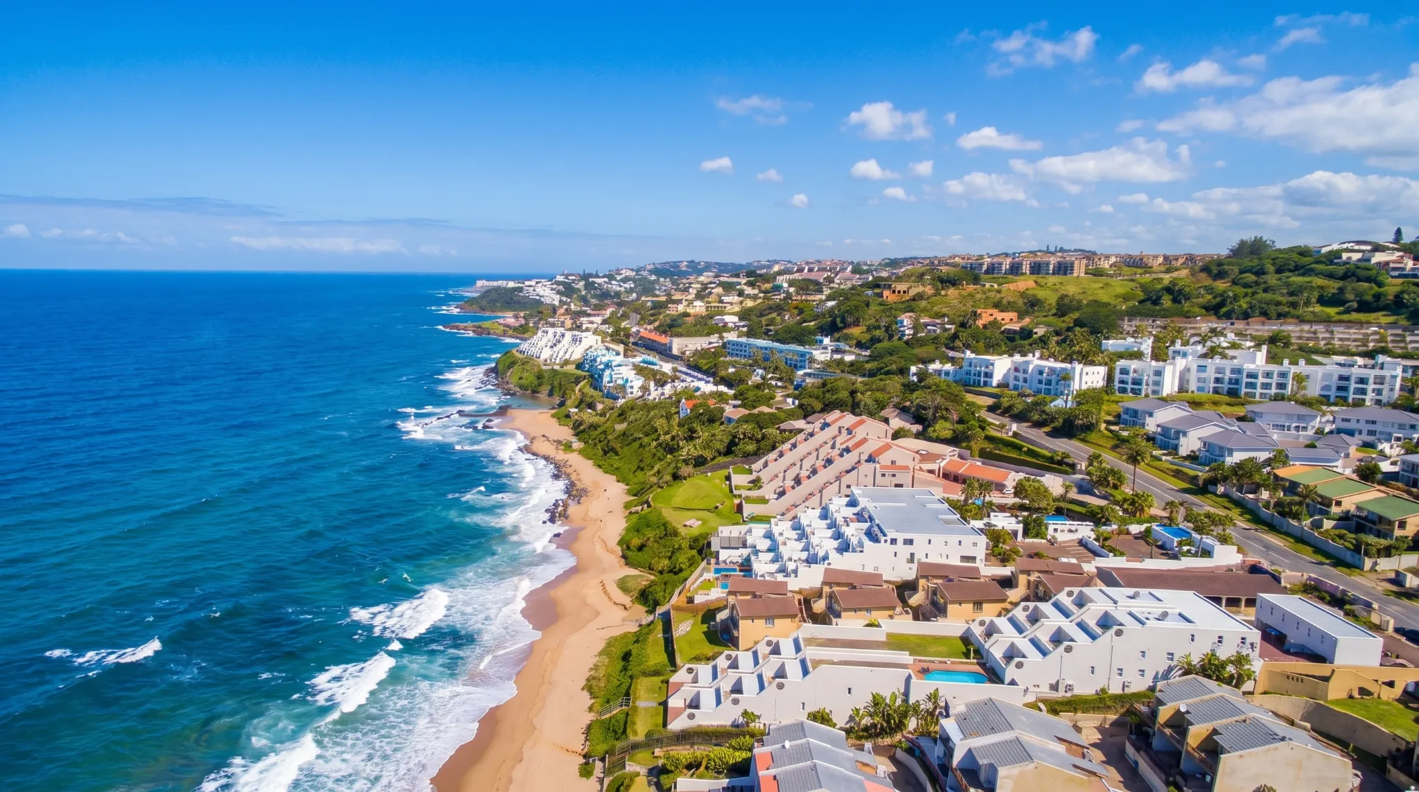 Coastal homes and resorts line the beach on the beautiful shoreline in Ballito.